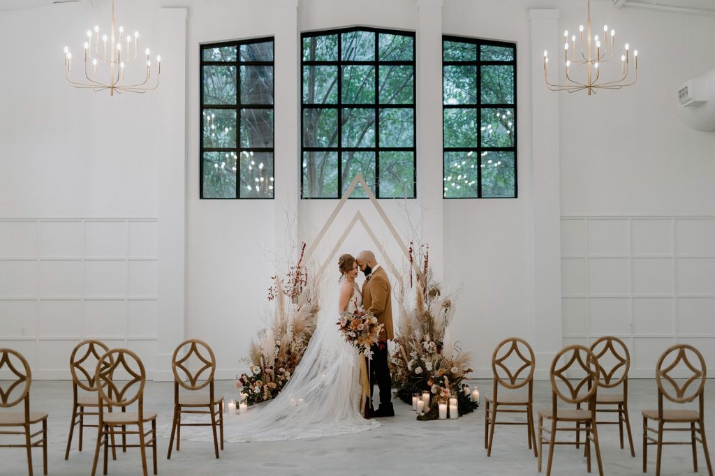 A wedding couple is getting married in the Distillery in one of the North Carolina wedding venues.