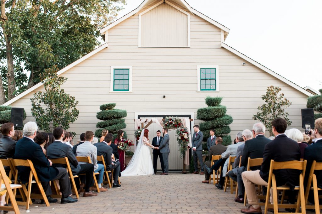 A wedding couple is getting married at the Scribner Bend Vineyards.