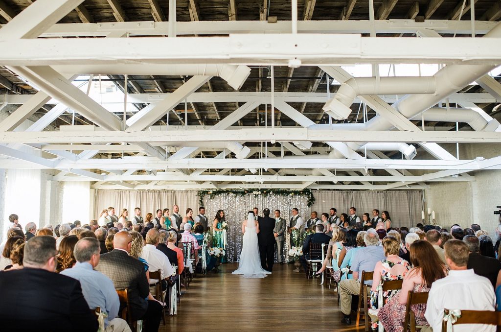 A wedding couple is getting married at the BridgeStreet Gallery and Loft, one of the wedding venues Birmingham AL offers.