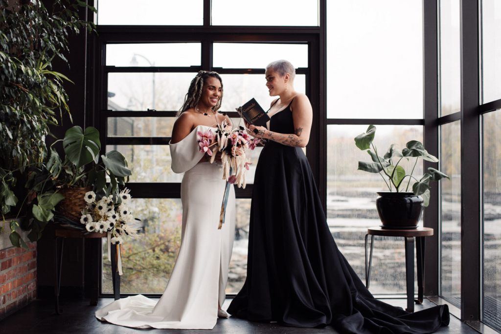A wedding couple is exchanging vows at Waterworks, one of the Vermont wedding venues.