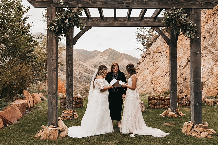 A wedding couple is getting married at the Louland Falls, one of the wedding venues Salt Lake City offers.